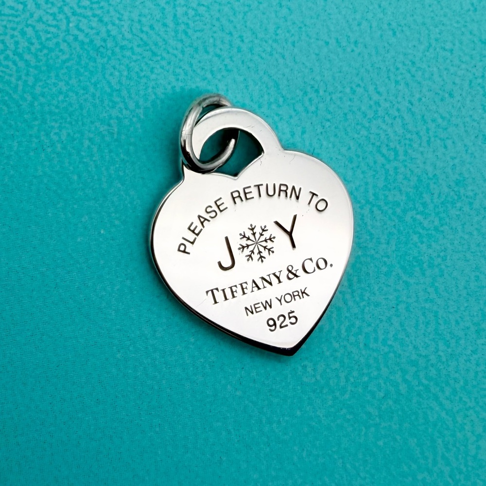 Tiffany & Co. please return to joy holiday 2024 charm pendant in sterling silver
